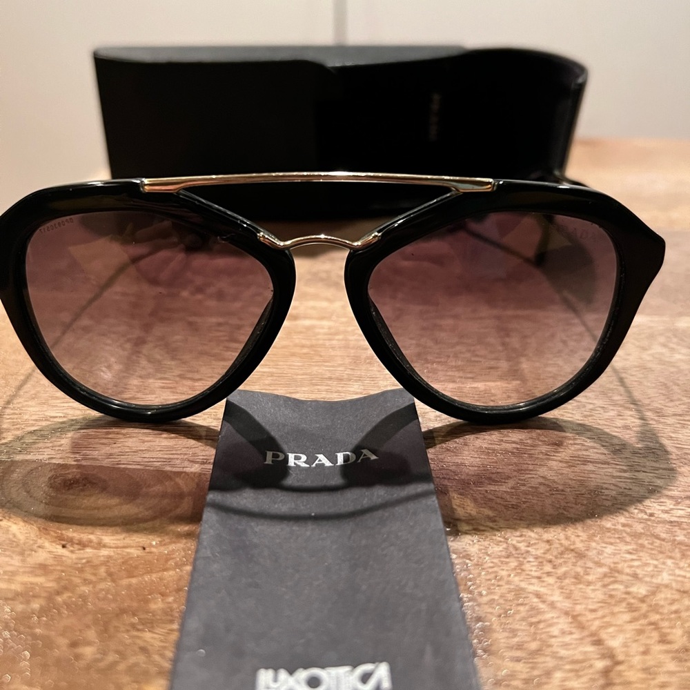 Prada sunglasses with original case and care tag